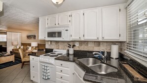 Deluxe Room, 1 Bedroom, Non Smoking | Private kitchen | Coffee/tea maker, full-size fridge, microwave, oven