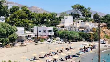 On the beach, sun loungers, beach towels