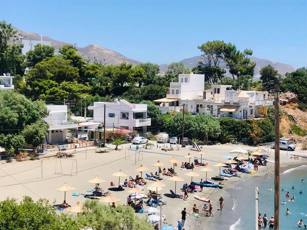 On the beach, sun loungers, beach towels