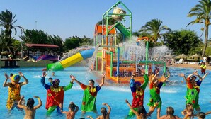 A water park with a water slide and various play structures. - Hotel Torrejoven (Torrevieja)