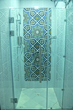 Shower, hair dryer, slippers, towels