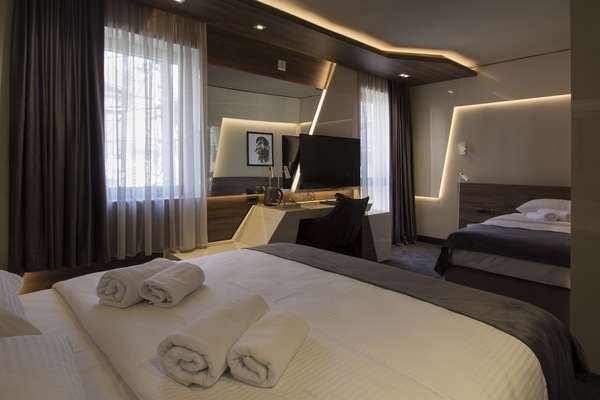 Deluxe Triple Room, Balcony | Frette Italian sheets, premium bedding, pillowtop beds, minibar