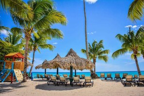 Private beach, white sand, sun loungers, beach umbrellas