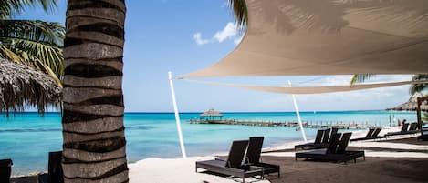 Private beach, white sand, sun-loungers, beach umbrellas