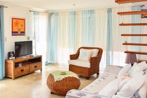 Comfort Apartment | Living area | 32-inch LCD TV with cable channels, TV, DVD player - Cadaques Caribe Apartment (San Rafael del Yuma)