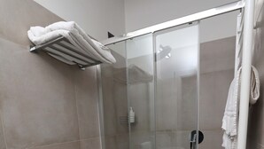 A modern bathroom with a glass-enclosed shower, a toilet, and a bidet. - b & b in the historic center, with a panoramic terrace, 400 meters from the sea (Pizzo)