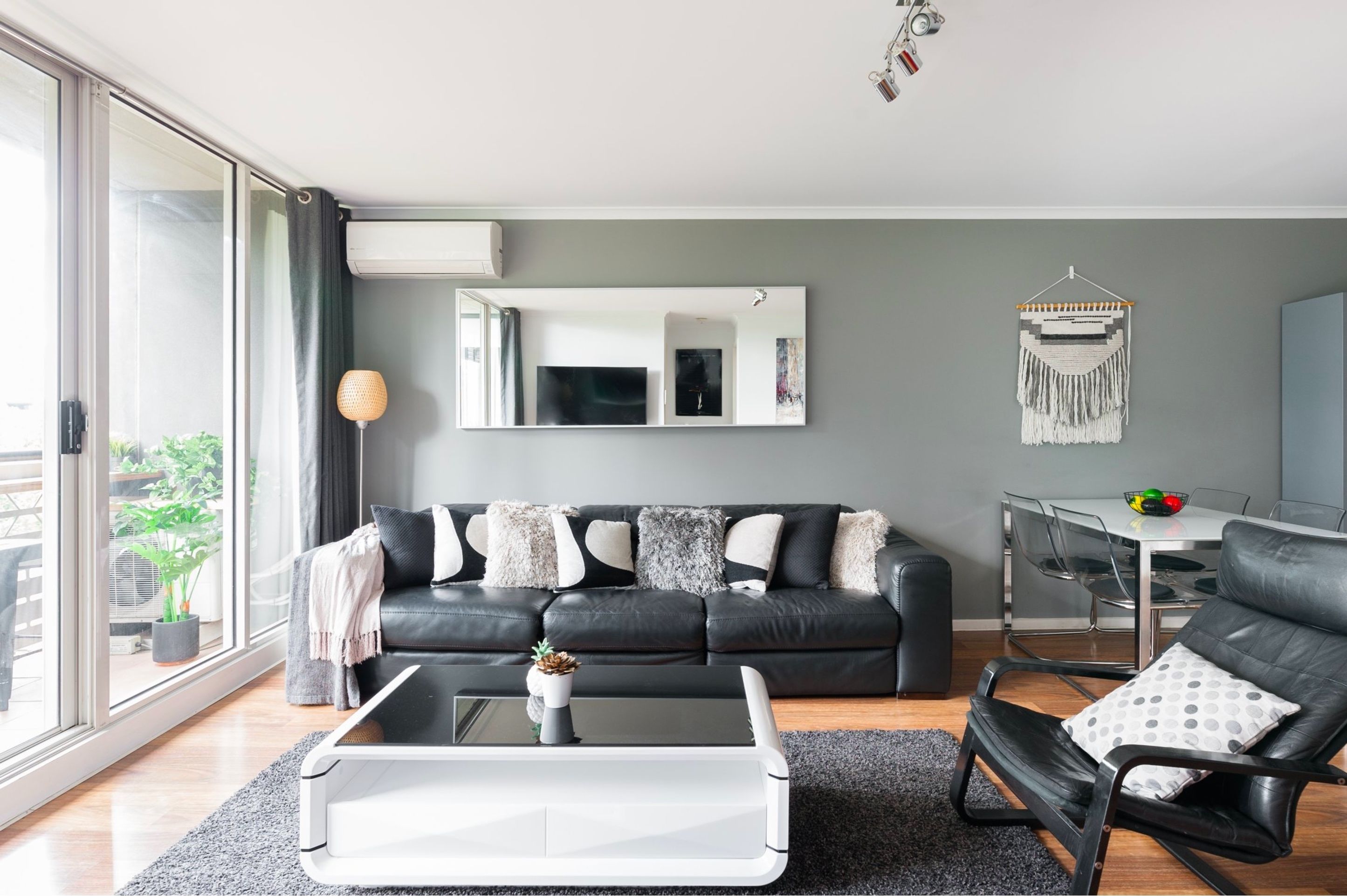 Spacious & Stylish Apartment with Balcony, Tennis, Gym, Pool | Living room | 55-inch Smart TV with digital channels, TV, video-game console