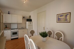 Enjoy cooking in this well-equipped kitchen with a microwave, stove, and sink.
