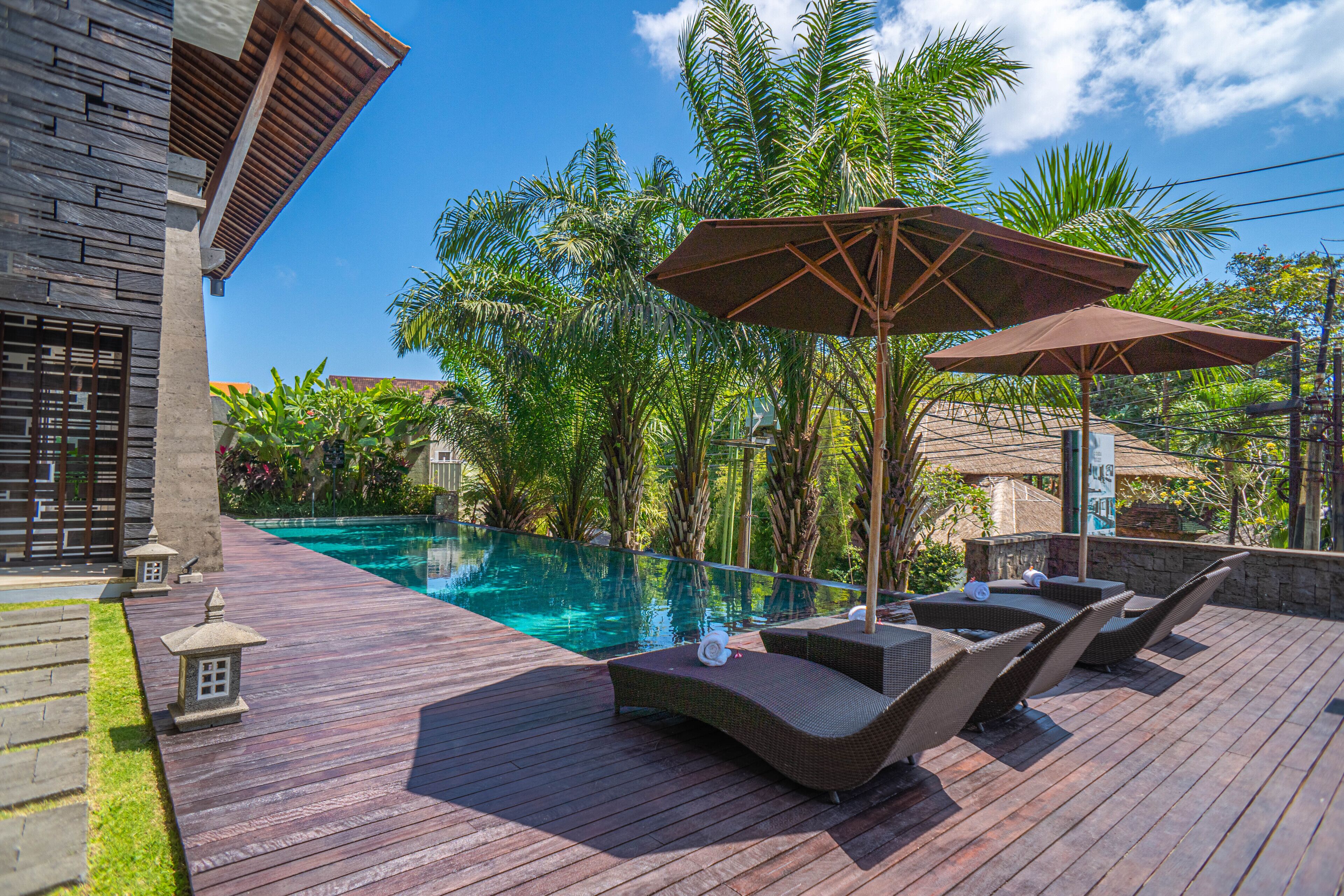 Outdoor pool, pool umbrellas, sun loungers