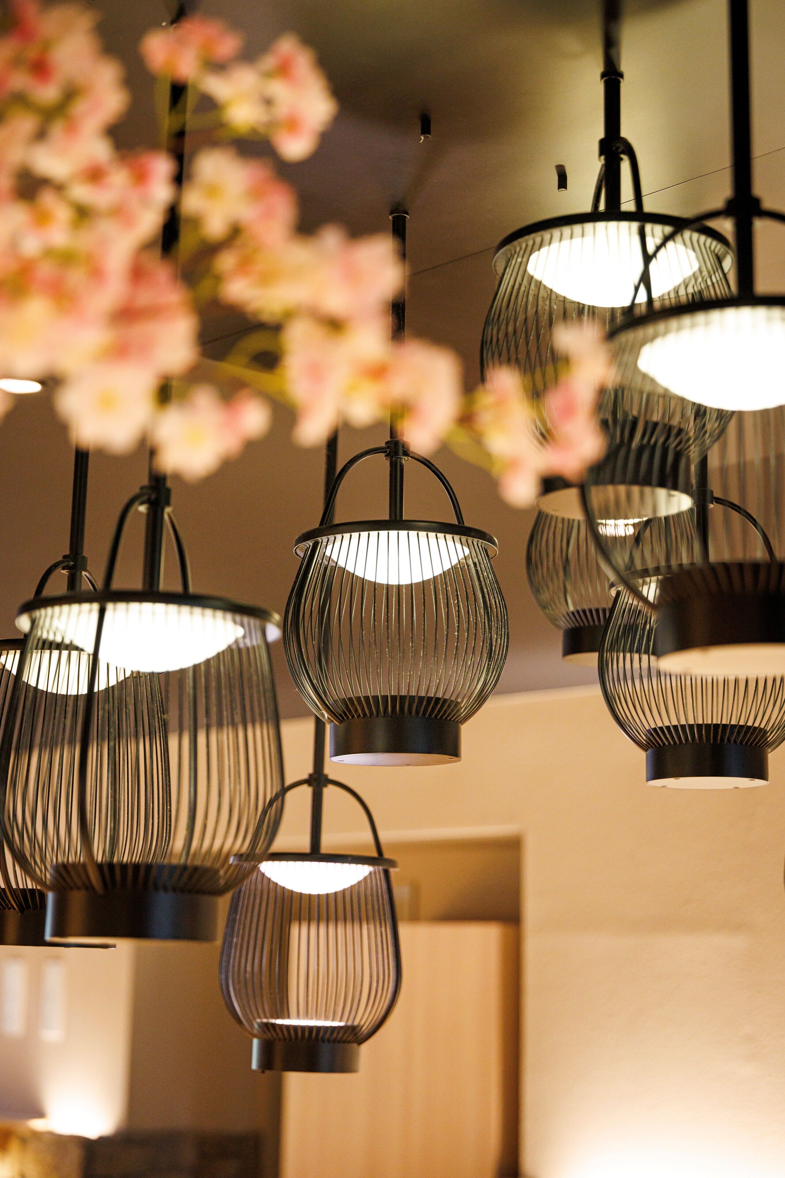 A series of hanging pendant lights with a ribbed design.