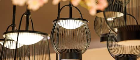 A series of hanging pendant lights with a ribbed design.