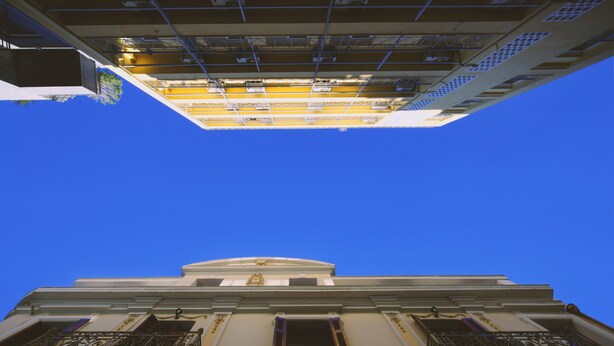 A building with a classical architectural style, featuring a prominent central dome and symmetrical balconies. - (0Β) Two Bedroom Ground Floor PRIVATE Apartment in Psiri-Historic Center! (Athina)
