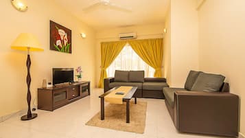 Basic Apartment, 3 Bedrooms | Living area | 32-inch LCD TV with digital channels, TV