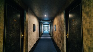 A long, narrow hallway with doors marked 207 and 208, leading to rooms. - The Celecton Kurashiki Mizushima (Kurashiki)