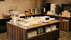 A buffet setup with various food items, a coffee machine, and a refrigerator. - The Celecton Kurashiki Mizushima (Kurashiki)