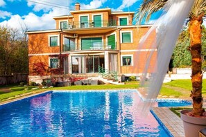 Seasonal outdoor pool, pool umbrellas, pool loungers