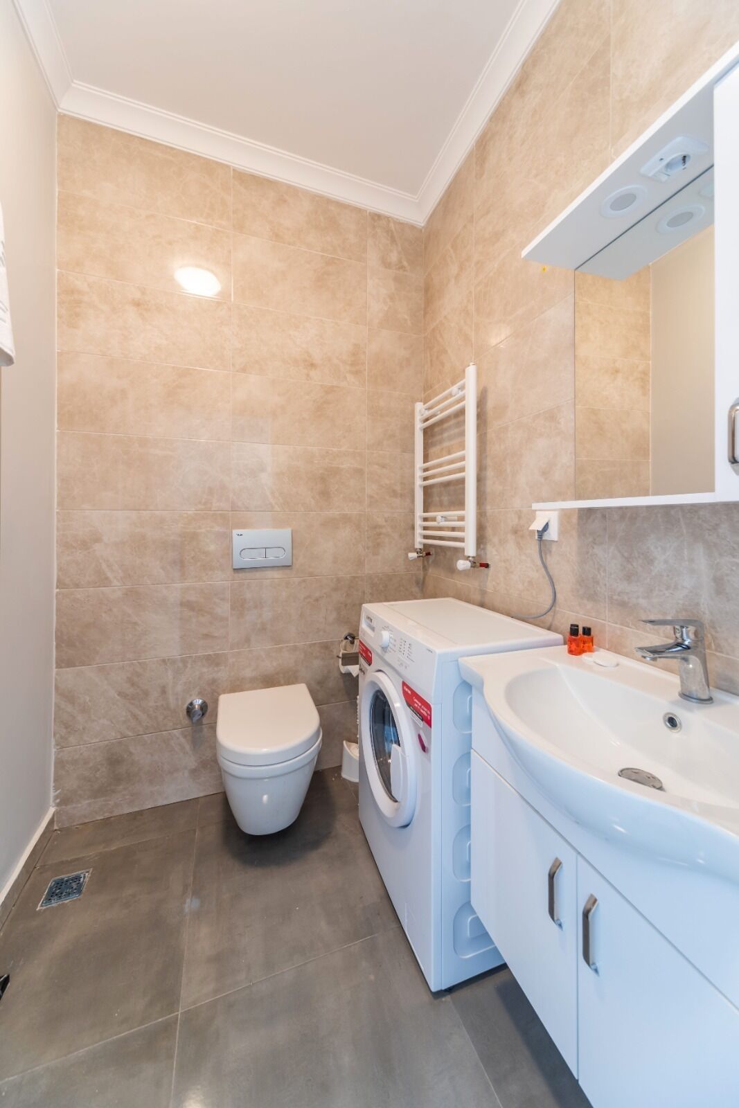 deluxe suite | bathroom | shower, rainfall showerhead, hair dryer, slippers