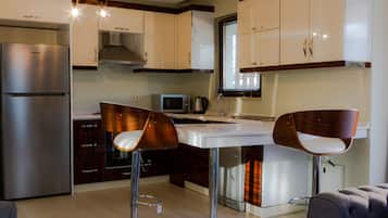 Apartment, 2 Bedrooms | Private kitchenette | Fridge, microwave, oven, stovetop