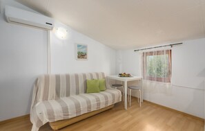 Apartment, 1 Double Bed with Sofa bed | Living room | 65-cm TV with satellite channels - Apartments Stanisic (Fazana)