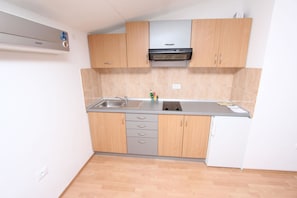 Apartment, 1 King Bed | Private kitchen | Fridge, stovetop, espresso maker, electric kettle