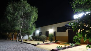 A building with a sign reading "Los Palmitos." - Los Palmitos Hospedería Rural (Nijar)