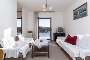 Apartment, Multiple Beds | Living room | 65-cm TV with satellite channels - Apartments Franko (Pula)