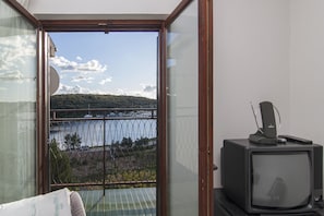 Appartement, meerdere bedden | Uitzicht op strand/zee