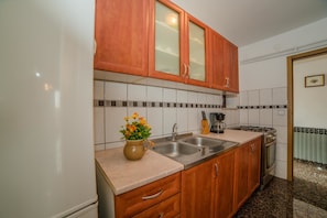 Apartment, Multiple Beds | Private kitchen | Fridge, microwave, stovetop, espresso maker