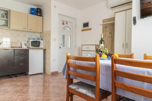 Apartment, Multiple Beds | Private kitchen | Fridge, microwave, stovetop, espresso maker