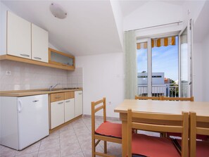 Departamento, varias camas | Cocina privada | Parrilla de estufa 