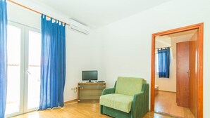 Apartment, Mehrere Betten | Wohnzimmer