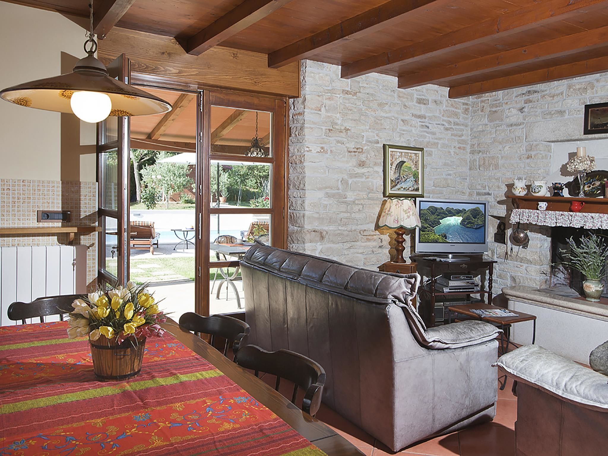 Villa, Multiple Beds | Living room | TV, fireplace