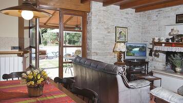 Villa, Multiple Beds | Living room | TV, fireplace