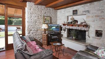 Villa, Multiple Beds | Living room | TV, fireplace