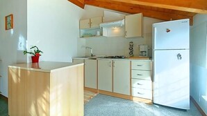 Appartement, plusieurs lits | Cuisine privée