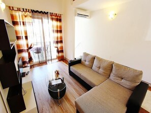 Apartment, Multiple Beds | Living room | TV