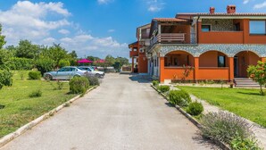A two-story building with a stone facade and a balcony. - Apartments Ana Pula / Exclusive two Bedroom A5 (Pula)