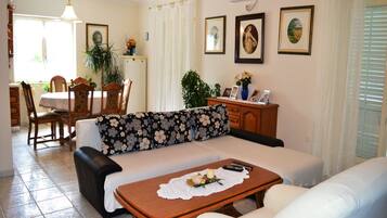 Apartment, Multiple Beds | Living room | TV