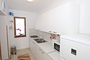 Appartement, plusieurs lits | Cuisine privée