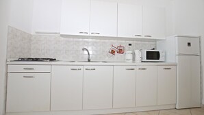 Appartement, plusieurs lits | Cuisine privée
