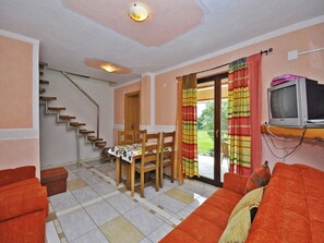 Apartment, Multiple Beds | Living room | TV