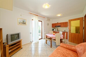 Apartment, Multiple Beds | Living room | TV
