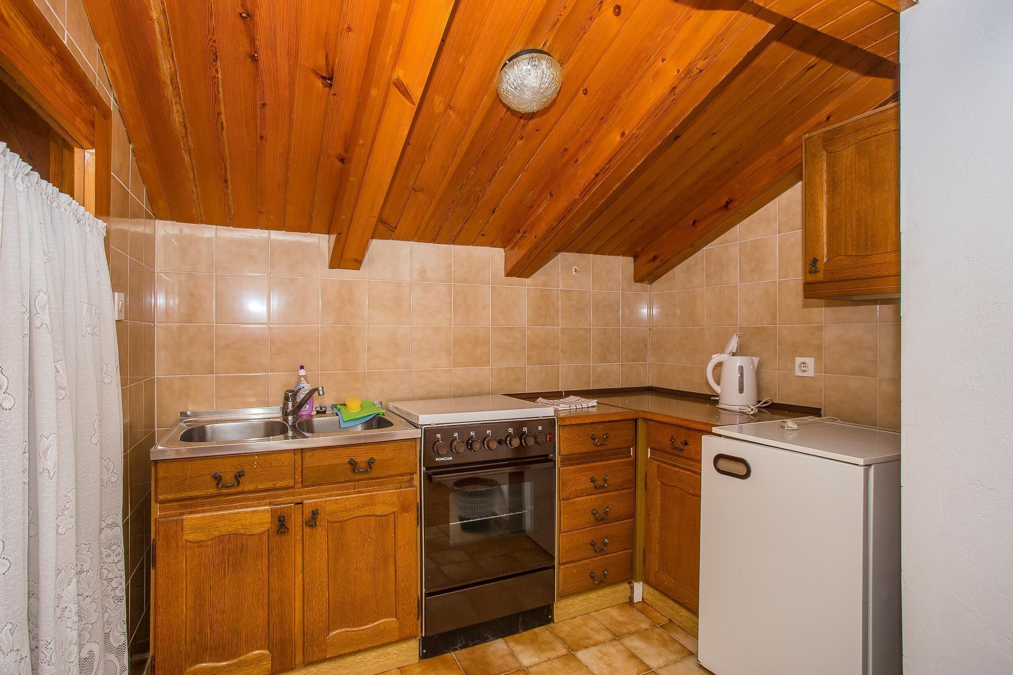 Apartment, Multiple Beds | Private kitchen | Fridge, stovetop