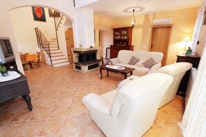 Apartment, Multiple Beds | Living room | TV