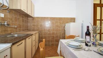 Appartamento, letti multipli | Cucina privata | Piano cottura, pentole/stoviglie/utensili