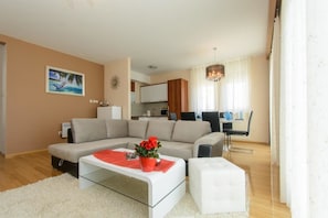 Apartment, Multiple Beds | Living room | TV