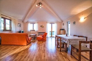 Apartment, Multiple Beds | Living room | TV
