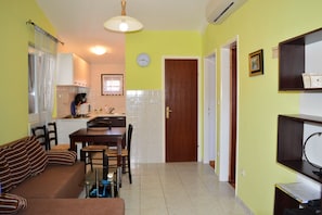 Apartamento, várias camas | Cozinha privada | Cooktop