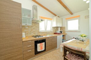 Apartment, 1 Double Bed with Sofa bed | Private kitchen | Stovetop, dishwasher, cookware/dishes/utensils