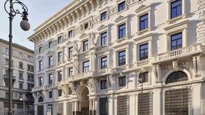 A historic building with ornate architectural details, multiple windows, and a prominent entrance with decorative ironwork. - DoubleTree by Hilton Trieste (Trieste)